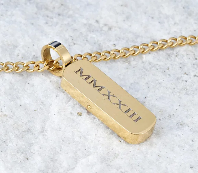 Gold-tone bar necklace engraved with Roman numerals